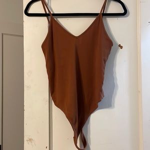 Burnt orange ribbed body suit